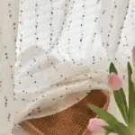 Voilage effet lin à petits pompons multicolores